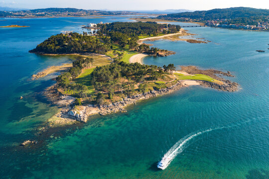 Aerial View of the Golf Course on Illa da Toxa and the Sandy Coastline of Illa de Arousa at Sunset Galicia