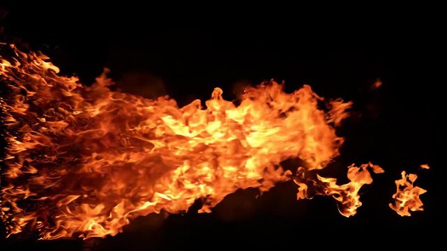 Dynamic Fire Breathing Display Against Black Background.