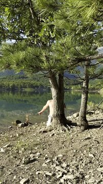 Martial Arts Conditioning: Man Striking a Tree Trunk in Early Morning Light