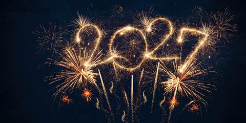 happy new year, new year's eve, silvester, new years eve, sparklers celebration greeting card, new year card - Year 2027 in sparkler font and firework fireworks pyrotechnic, blue night sky background © Corri Seizinger