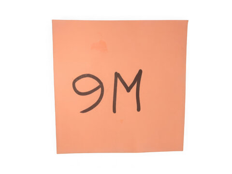 Orange sticky note with nine million written on paper sheet