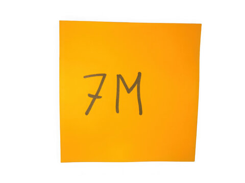 Bright orange sticky note with the text 7M written on it