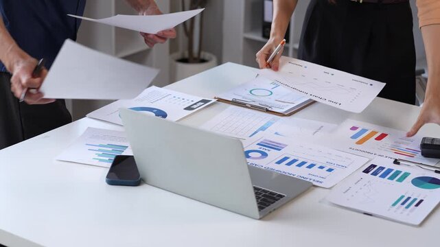 Business people analyzing data and financial reports