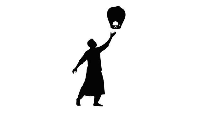 Silhouette of person releasing sky lantern into night sky