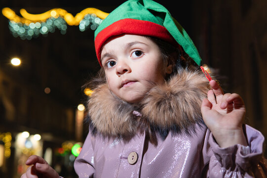 Little girl wearing elf hat during christmas holidays