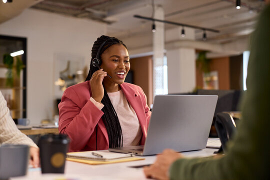 Black customer service woman on call with big smile