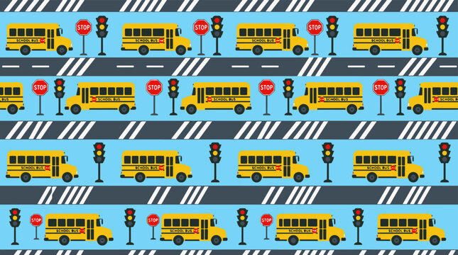 School buses driving on road with traffic lights and stop signs.