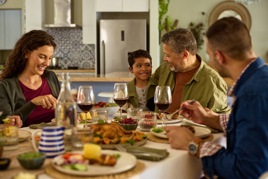 Multiethnic family eating together at home
