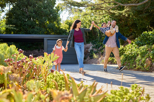 Happy family walking and playing together outdoor