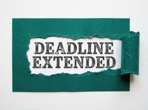 Ripped Teal Paper Revealing 'DEADLINE EXTENDED' Text, Time Management Concept