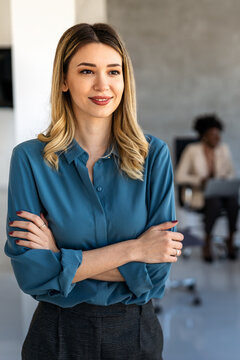 Professional in office environment, highlighting teamwork, collaboration, leadership, and innovation
