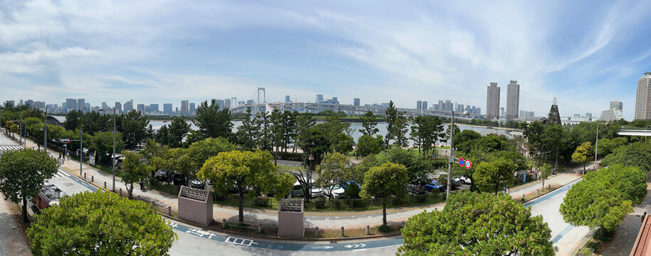 Panoramic daylight web banner of Rainbow Bridge and Tokyo Tower from Odaiba