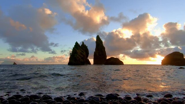 Afterglow over Atlantic behind Flores sea stacks end credits background for travel docs, Azores