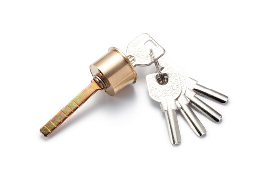 A brass cylinder door lock with set of five keys isolated on white background