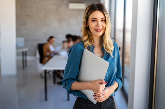 Successful executive standing proudly in office, representing business growth, partnership
