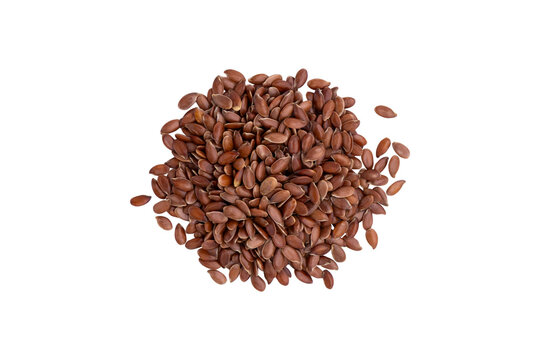 pile of organic brown flax seeds isolated on white background, top view
