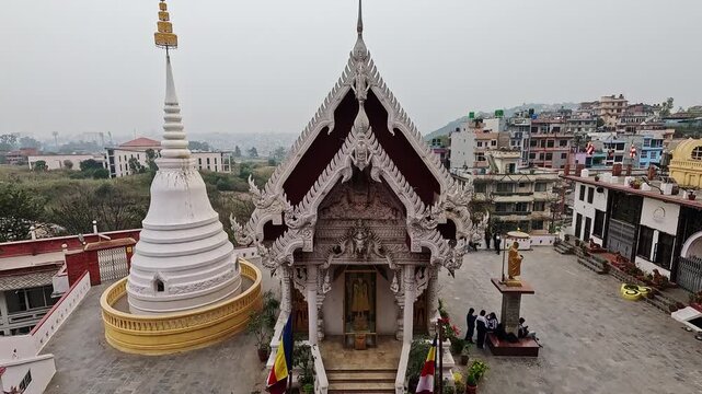 Nagar Mandap Shree Kirti Bihar Thai temple frontal wide, gold-roofed shrine and white stupa with Buddha statue, Kirtipur Nepal