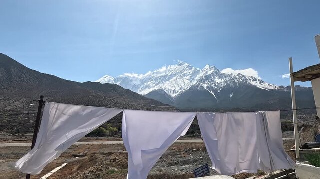 White laundry drying line Nilgiri snow peaks Jomsom Mustang Nepal Himalaya mountain view