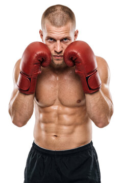 strong muscular boxer with red gloves stands in a fighting pose