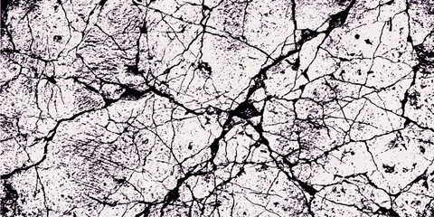 A textured surface displays a network of intricate cracks, creating a visually striking abstract pattern. © ABRAR