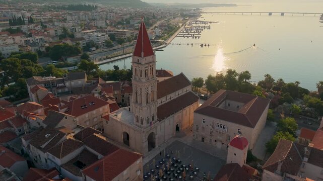 Croatia captivates with Trogir stunning old town, where ancient architecture meets serene waters. Witness the vibrant culture and scenic beauty during a magical sunset glow.