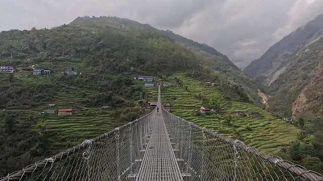 Stone farmhouse on terraced hillside above the valley near Jhinu Danda, Annapurna Base Camp trek, Nepal