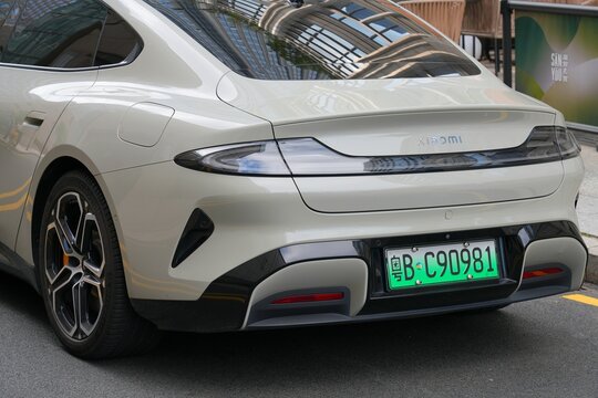 SHENZHEN, CHINA - NOVEMBER 6, 2025: Xiaomi SU7 fastback electric car, Chinese car model parked in a street in Shenzhen, China.