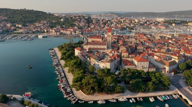 Croatia captivates with Trogir, a historic coastal gem known for its stunning architecture and vibrant atmosphere. Explore its quaint streets, waterfront, and bustling harbor under the warm sun.