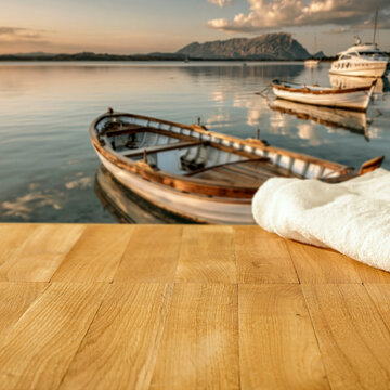Lake camping with mountain view and copy space &ndash; outdoor summer adventure concept. Boats and natural outdoor setting perfect for travel, camping, lifestyle and adventure-related campaigns, calm water.