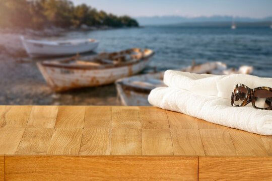 Lake camping with mountain view and copy space &ndash; outdoor summer adventure concept. Boats and natural outdoor setting perfect for travel, camping, lifestyle and adventure-related campaigns, calm water.