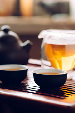 Tea cups with Chinese tea on the table for the tea ceremony