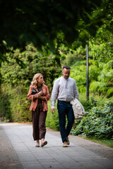 Fototapeta premium Couple walking and discussing in park