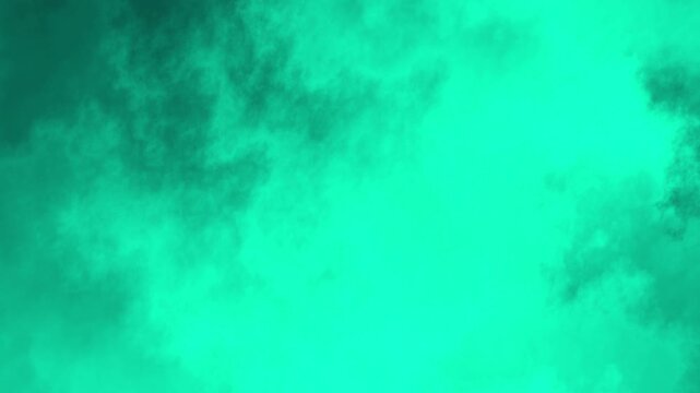 Ethereal cyan smoke swirling in fluid motion