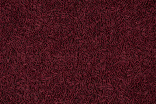 Burgundy, textured fabric background, with intricate pattern, maroon dark red