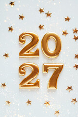Metal numbers 2027 on a white table. Happy New Year 2026 is coming concept. © Anna