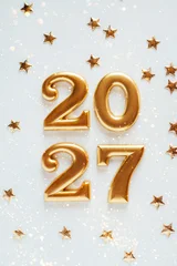 Metal numbers 2027 on a white table. Happy New Year 2026 is coming concept. © Anna