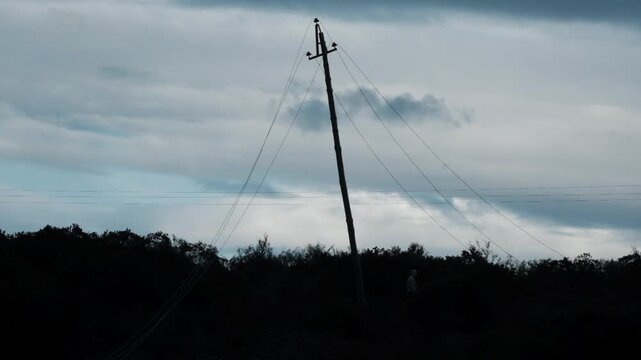 High power electrical pole and wires that have collapsed after copper wire theft in South Africa