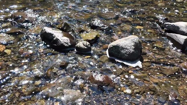 4K footage of powerful Youngs River Falls near Astoria, Oregon, USA with sunlight illuminating water spray and mist on a beautiful summer day in the Pacific Northwest