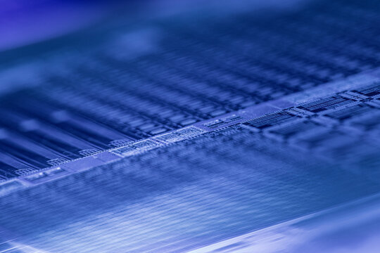 Silicon wafer surface showing microchips and circuits