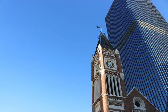 Perth Town Hall clock tower and modern skyscraper in Perth, Western Australia