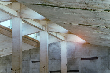 Obraz premium industrial warehouse or commercial area in an architectural background with bare cement pillars supporting a ceiling before construction
