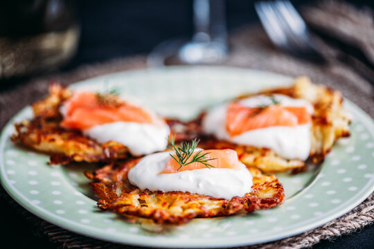 Potato pancakes with sour cream and smoked salmon