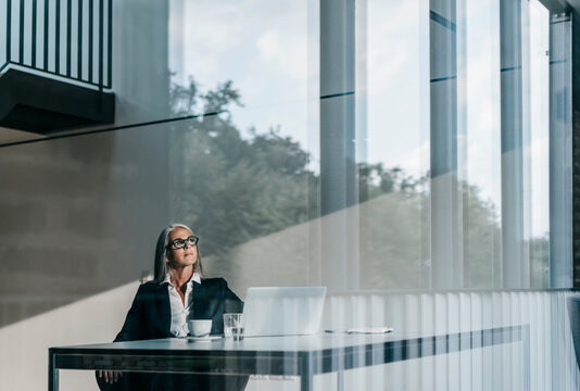 Businesswoman at desk with laptop