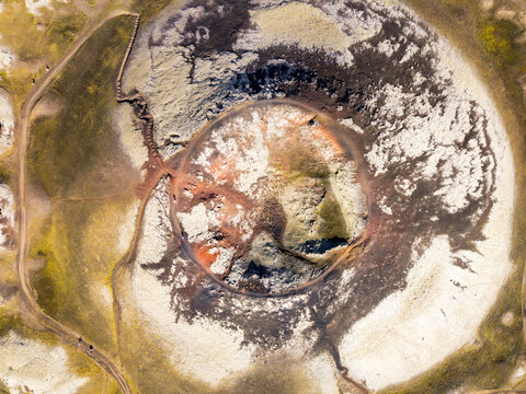 Aerial view shows St�tur volcano crater with iron and green lichen