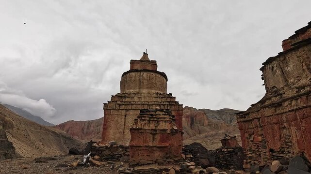 Weathered red Buddhist chorten in eroded canyon en route to Dhakmar, Upper Mustang, Nepal