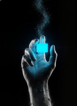 Hand holding blue flame cube with futuristic energy effect