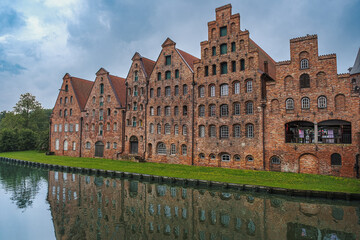 Fototapeta premium The famous salt warehouse on the Trave River in Lübeck