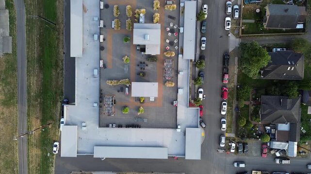 Rooftop amenity decks incorporate modern landscaping above mixed use properties near downtown Kent. Architectural innovation enhances structural utility within growing urban centers found in WA