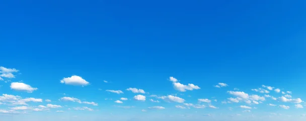 Blue Sky background with tiny Clouds. Panorama background © Pakhnyushchyy