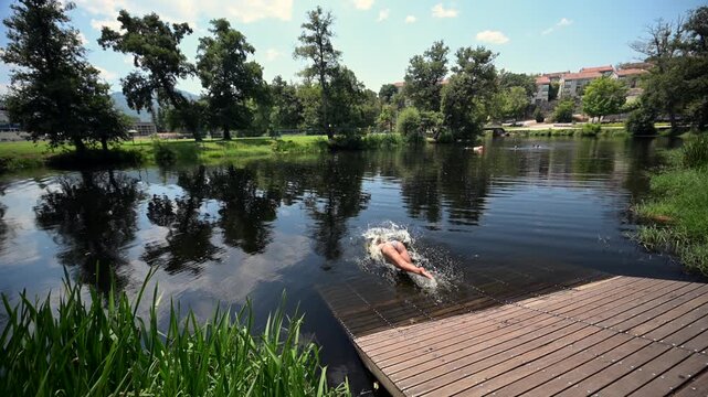 Woman Swimming in the Arnoia River to Cool Off During a Hot Summer Heatwave in Allariz Galicia Spain
